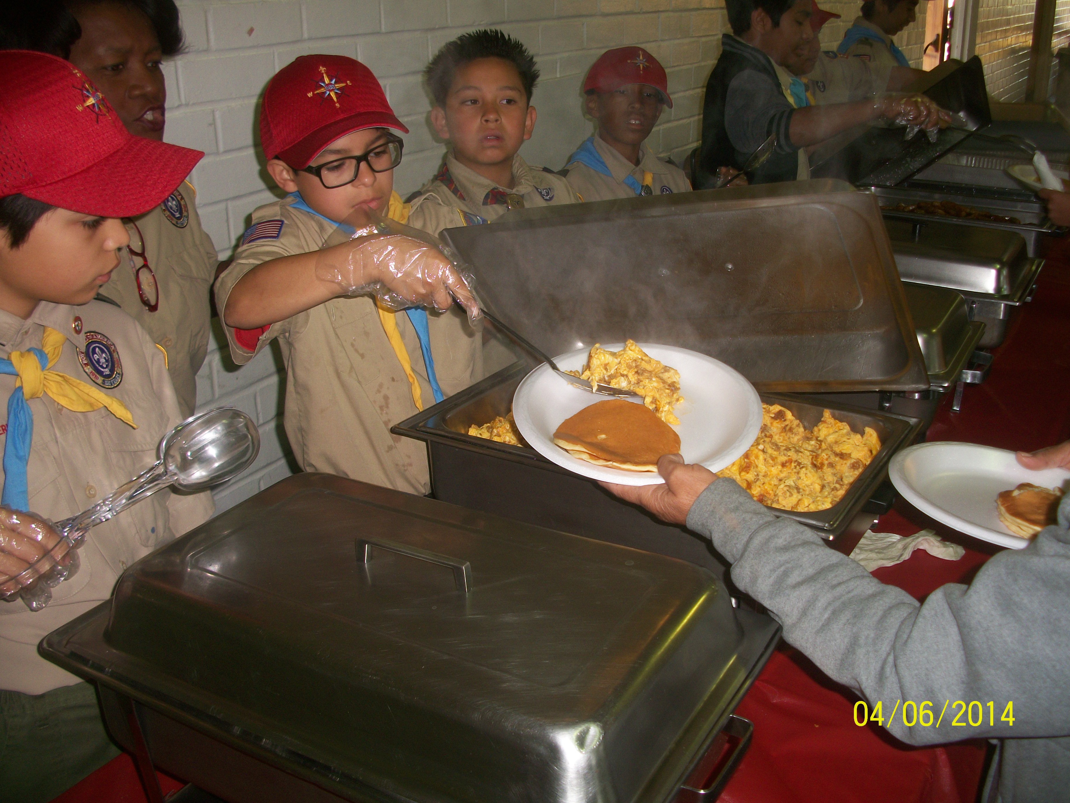 Newer Scouts serving the food
