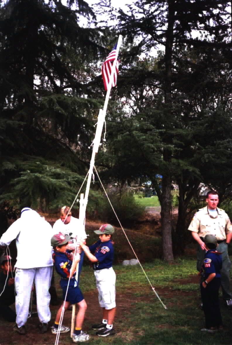 Raising a flagpole